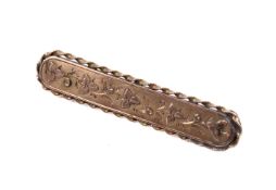 A 9ct rose gold bar brooch.