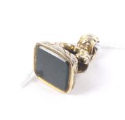 An early 19th century gold-plated and oblong bloodstone fob seal.