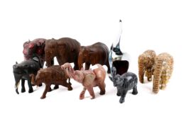A large collection of assorted elephant figures. Max.