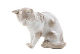 A vintage German pottery figure modelled as a sitting cat #6891.