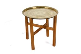 Brass tray top table with later stand. Circular tray with Indian design.