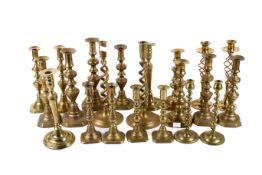 Twelve pairs of Victorian and later brass candlesticks Max H30cm