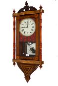 A late 19th century marquetry walnut veneered wall clock.