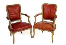 A pair of French style open armchairs.