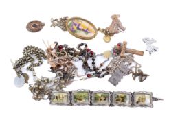 Assortment of jewellery including a silver ingot on chain.