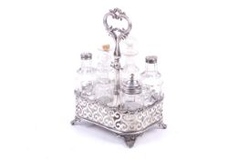 A Victorian silver plated condiment set with six cut glass bottles.