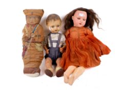 Two composite head dolls and a printed cotton Great War Staff Sergeant soldier soft toy doll.