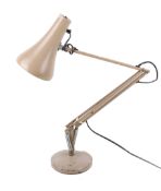 A Herbert Terry & Sons Ltd anglepoise model 90 desk lamp. On a circular base.