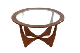 A mid-century G Plan Astro Fresco circular teak coffee table by E. Gomme. With a glass drop in top.