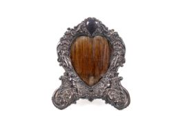 A sterling silver hallmarked heart shaped photo frame.