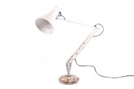 A mid-century Herbert Terry model '90' anglepoise desk lamp with round base.