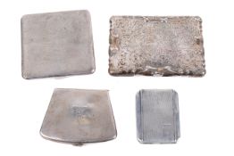 Four silver cigarette cases.