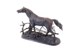 A cast metal model of a stallion.