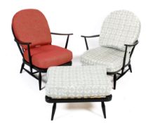 A pair of Ercol ebonised Windsor open armchairs and a foot stool. Model 203.