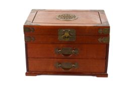 A large Chinese hardwood brass bound jewellery casket. Lidded top section above two drawers.