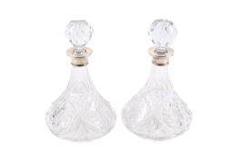 A pair of silver mounted decanters.