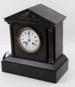 A Victorian slate mantel clock.