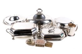A collection of silver plated items. Including entree dishes, mug, etc.
