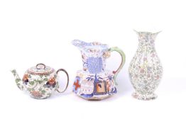 A Royal Doulton teapot and vase plus a Davenport Ironstone jug.