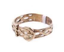 A 9ct gold buckle ring. Of three-quarter pierced design, size Y/Z, weight 3.9g.