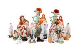 A collection of sixteen Staffordshire and continental 'Little Red Riding Hood' ceramics figures.