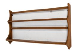 Mid-century Ercol wall mounted teak plate rack.