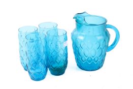 A set of turquoise pressed glass jug and four large glasses. Max.