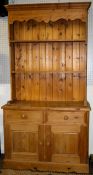 A contemporary pine kitchen dresser.