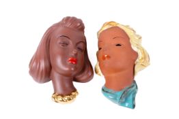 Two assorted mid-century ceramic wall masks.