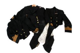 A collection of assorted Royal Naval officer's uniforms. Including a Gieves Ltd for 'V.