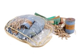 A collection of lace making tools. Including a cushion and bobbins, etc.