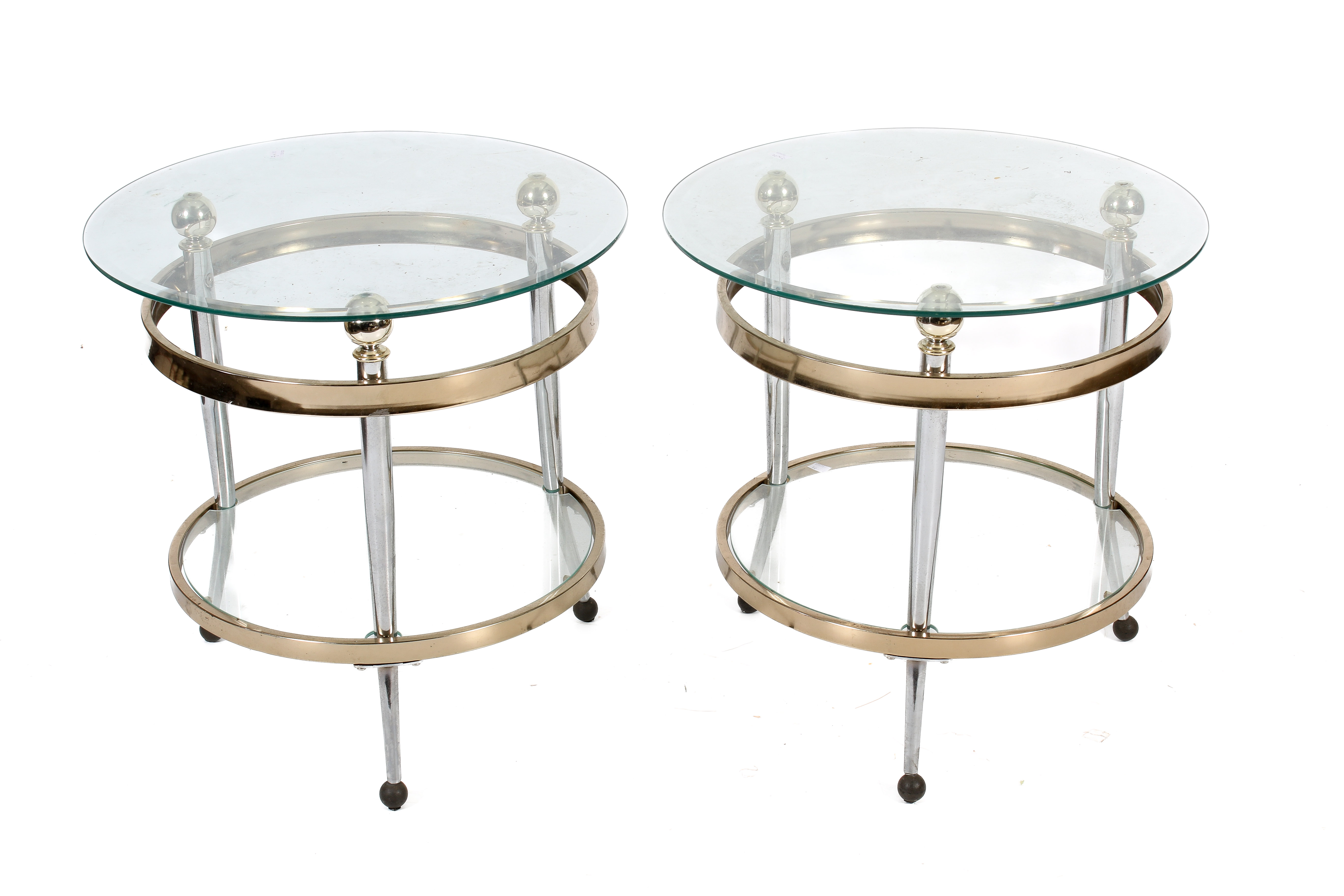 A pair of glass top coffee tables.