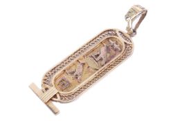 A yellow metal cartouche pendant. Tested as gold of approximately 18ct. 5.1 grams gross weight.