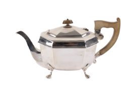 A silver teapot.