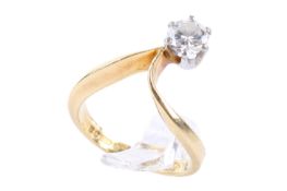 A yellow gold diamond solitaire ring. Set with one round brilliant cut diamond of 0.