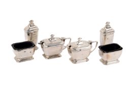 A silver condiment set.