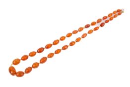 A faceted amber bead necklace. The beads translucent, measuring circa 0.7cm to 1.