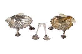 Two shell shaped silver salts and spoons.