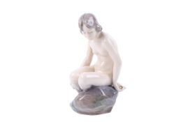 Royal Copenhagen porcelain figure 4029 'Girl on a Rock'. H14.