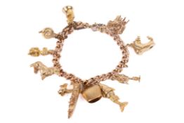 A rose gold charm bracelet with eleven charms of various designs.