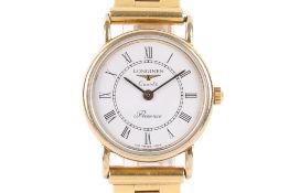 A lady's late twentieth century hallmarked 9ct gold Longines Presence dress watch. Round dial.