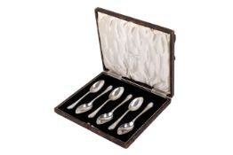 A set of six silver grapefruit spoons. With pointed oval bowl and engraved monogram.