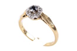 An 18ct gold diamond and sapphire cluster ring.