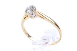 An 18ct gold single stone diamond ring. Set with one round brilliant cut diamond of circa 0.