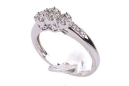A 9ct gold and diamond cluster ring.