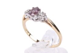 A diamond and pink, possibly tourmaline, 9ct gold ring. Size N, weight 1.7g.