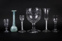 A collection of five assorted Georgian drinking glasses plus a Roman style bottle.