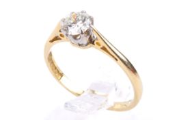 An 18ct single stone diamond ring. Set with one round brilliant cut diamond of circa 0.