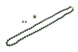 A dark green hardstone necklace, earrings and ring set.