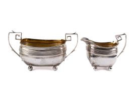 A Georgian silver sugar bowl and matching jug.
